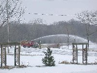 The local fire dept. refilling at the 'dry hydrant' on our lake. They just couldn't resist playing with the spray tho. Sprayed water on top of the ice.