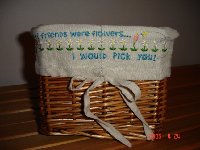 This basket came with a plain liner, I embroidered this design on the front and a border of just the flowers all around the other edges.