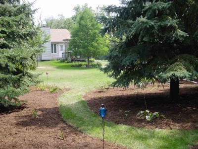 And this is where another path intersects, looking up that path and towards the back of the house.