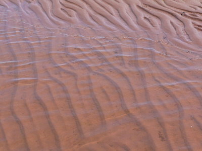 Red sand in shallow water, PEI, Canada
